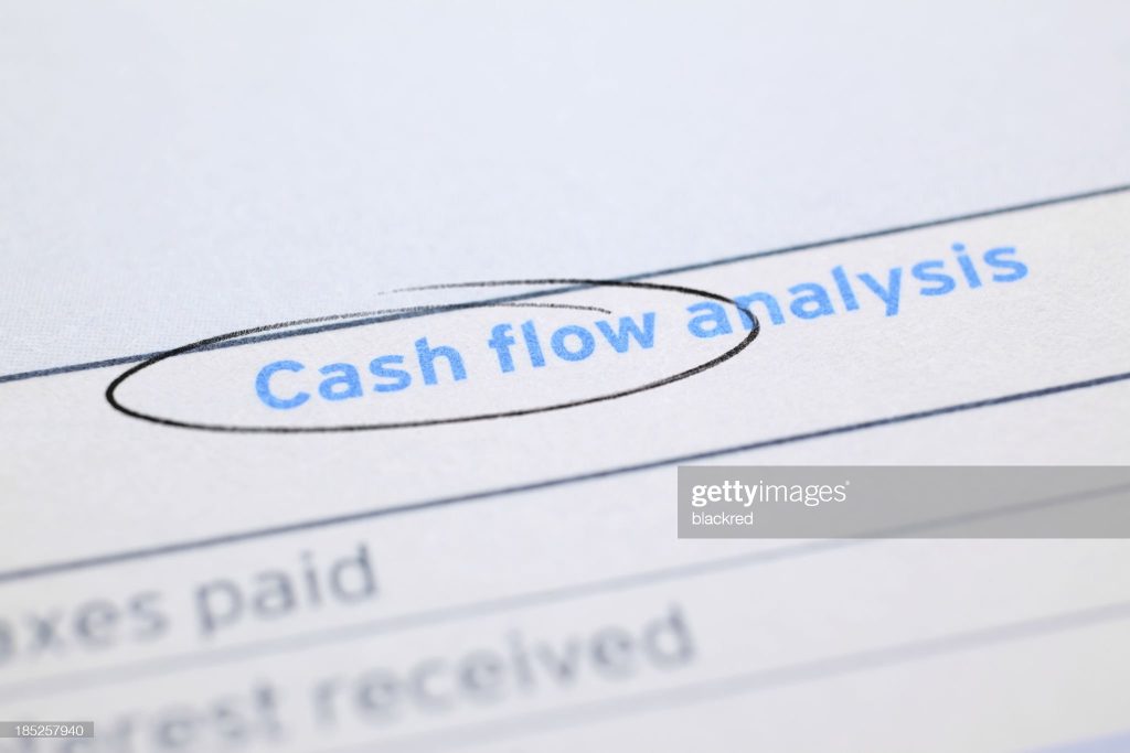 "Close-up on the financial document title - Cash Flow, circled by pen."